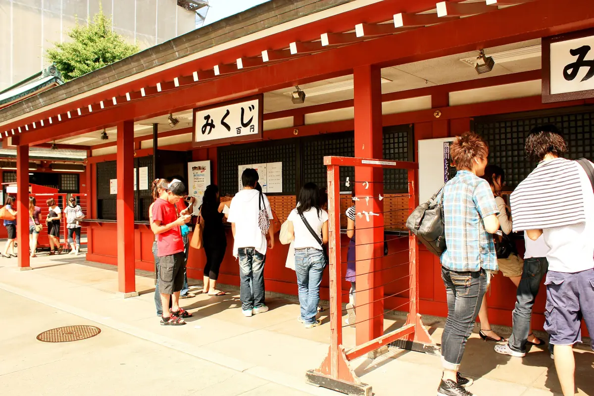 Visitors drawing omikuji at Senso-ji